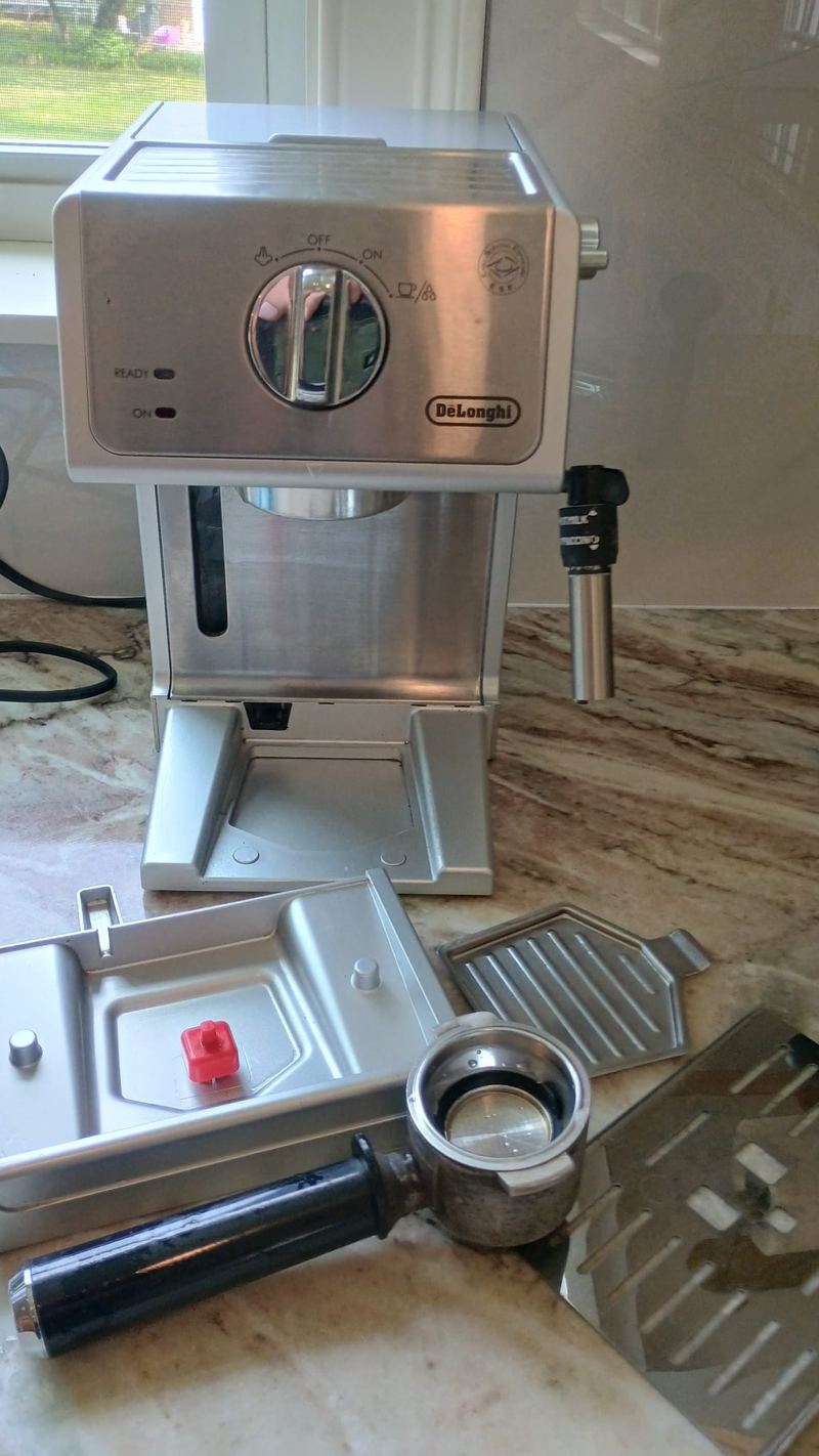 Espresso machine after cleaning, polished steel and clean drip tray